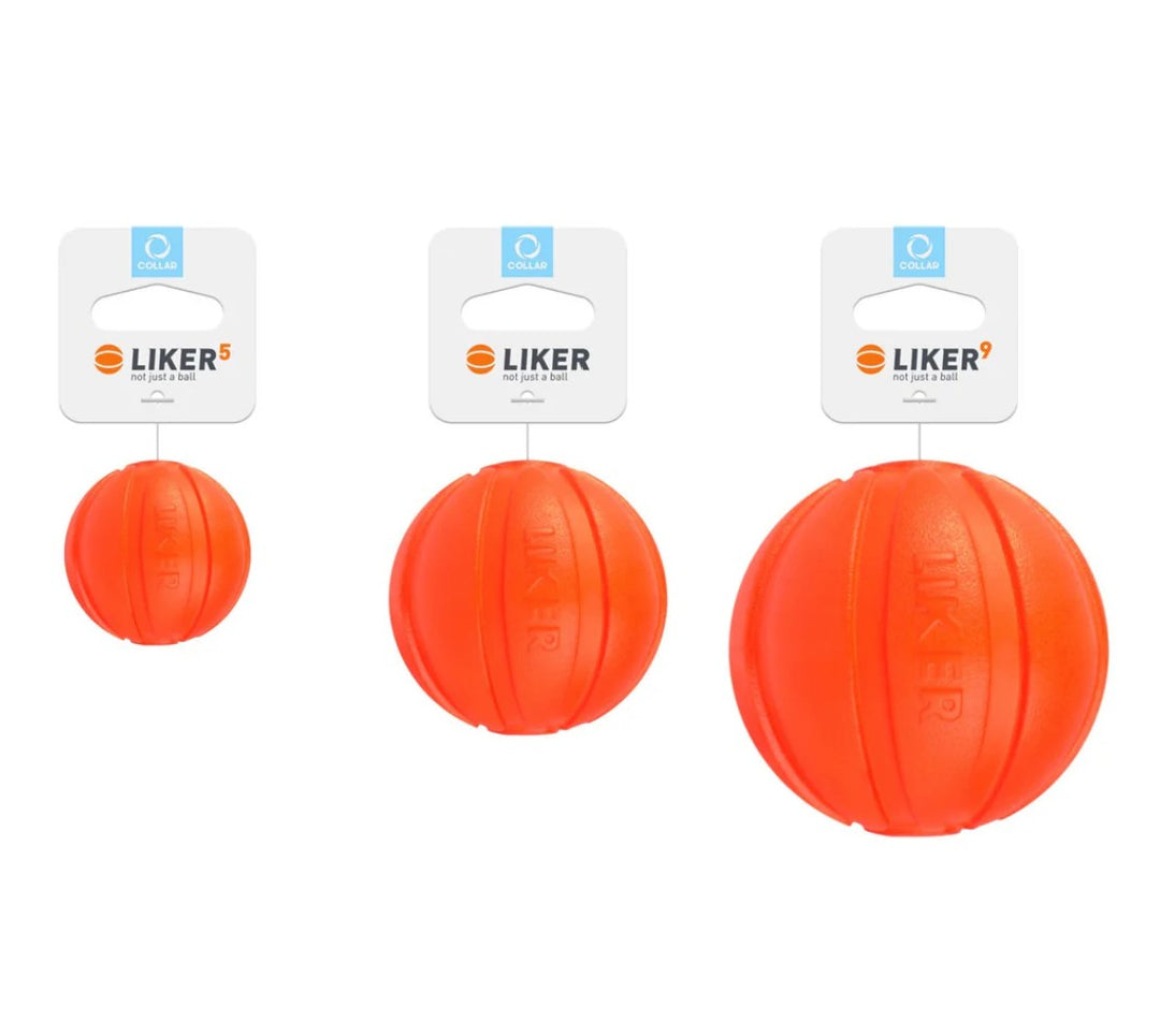 Three orange LIKER dog toys on white background The Golden Bone Bakery